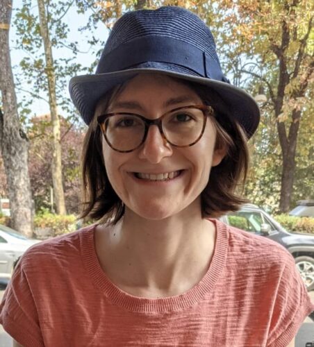 Headshot of Allie Lau wearing a hat