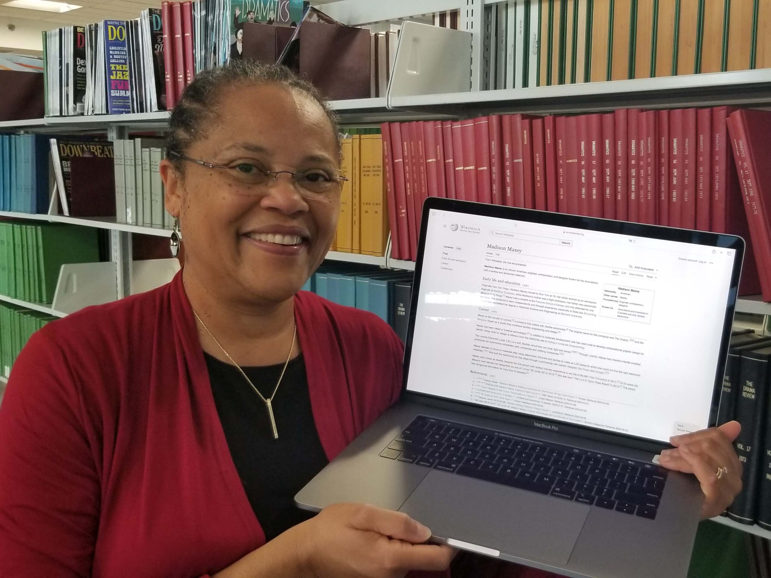Felecia Casey-Hicks with laptop showing the Madison Maxey Wikipedia article